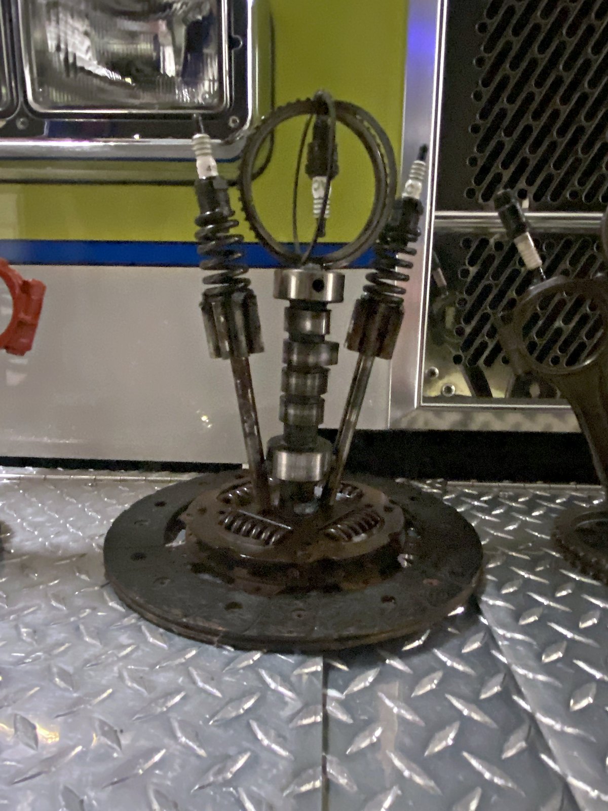 Handmade car show trophy — camshaft, valves and a clutch plate