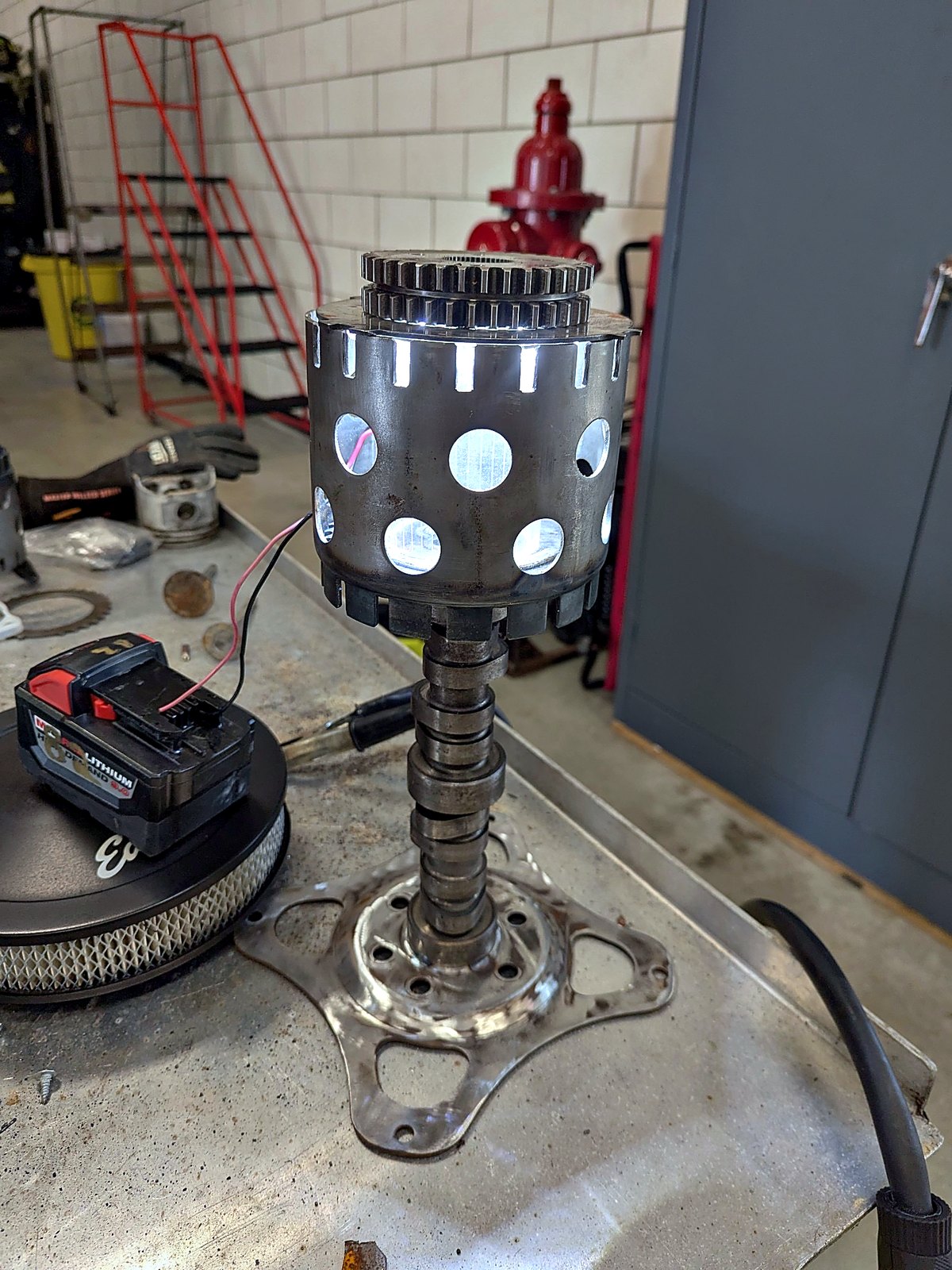 Handmade car show trophy — clutch basket on a camshaft